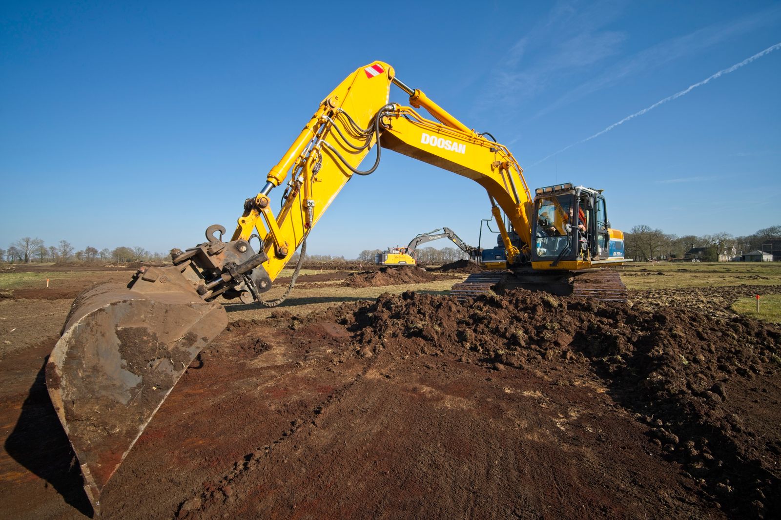 Yellow excavator at a construction site